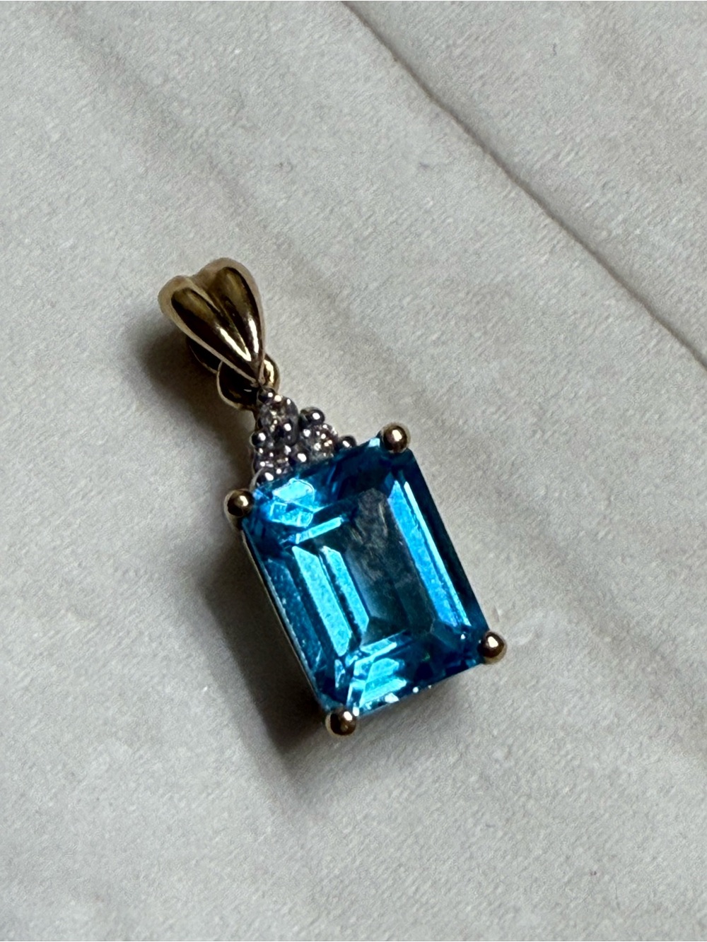 10k Emerald Cut Blue Topaz Pendant With Multi Diamond